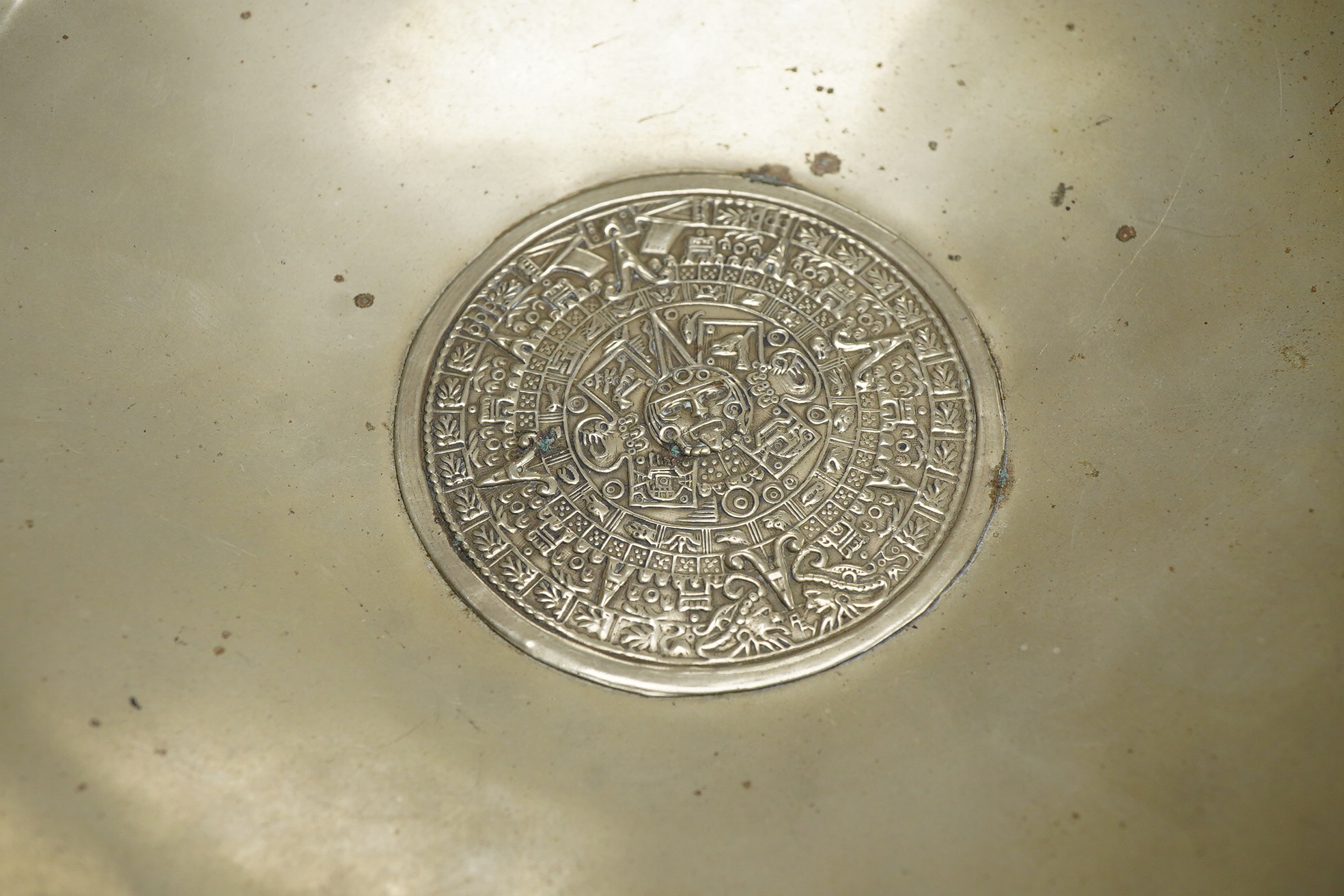 A Mexican sterling 925 dish, the centre embossed with the Aztec Sun Stone, diameter 18.7cm, 6.7oz.